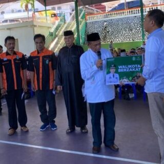 Pj Wali Kota Akbar Ali Pimpin Penyerahan Zakat Lewat Baznas
